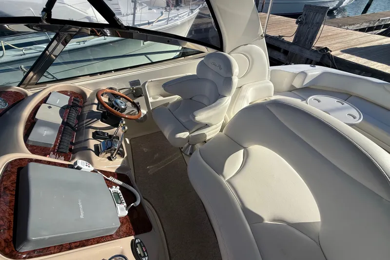 Off The Air Yacht Photos Pics 2004 Sea Ray 380 Sundancer helm with leather seating and modern controls.
