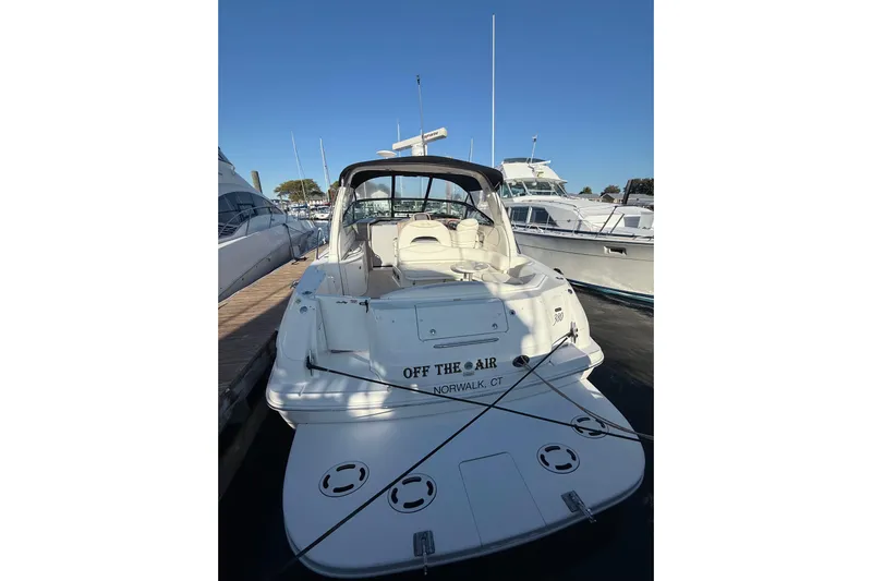 Off The Air Yacht Photos Pics 2004 Sea Ray 380 Sundancer docked at marina, rear view.
