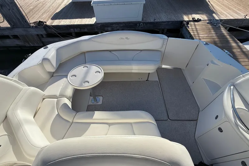 Off The Air Yacht Photos Pics 2004 Sea Ray 380 Sundancer boat interior with white seating and round table.