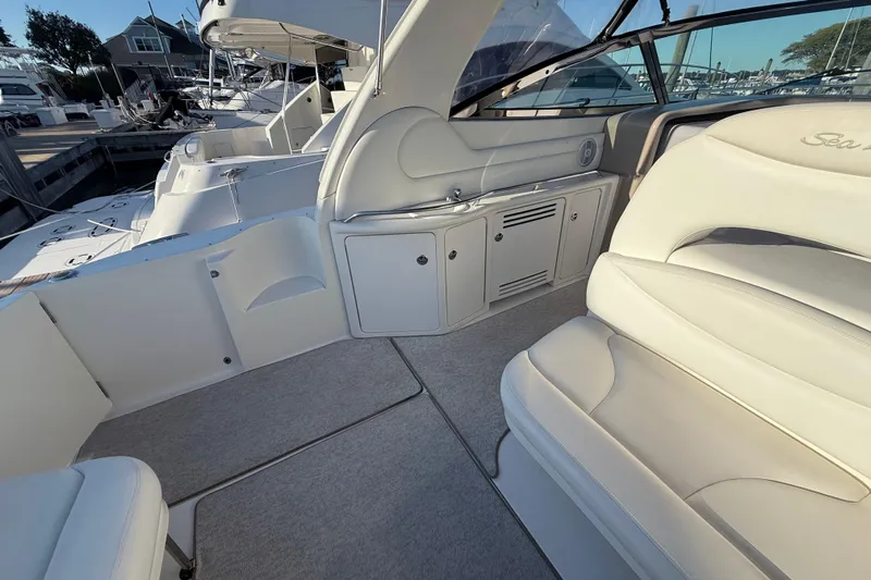 Off The Air Yacht Photos Pics Interior of 2004 Sea Ray 380 Sundancer yacht with white seating and cabinetry.