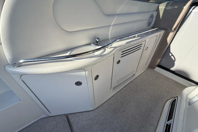 Off The Air Yacht Photos Pics 2004 Sea Ray 380 Sundancer interior with sleek cabinetry and stainless steel accents.