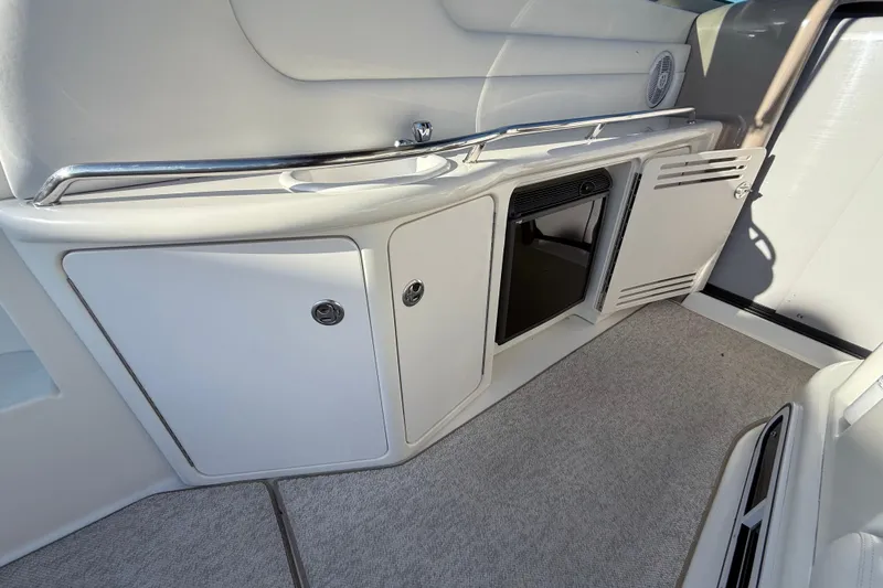 Off The Air Yacht Photos Pics 2004 Sea Ray 380 Sundancer interior with storage cabinets and carpeted flooring.