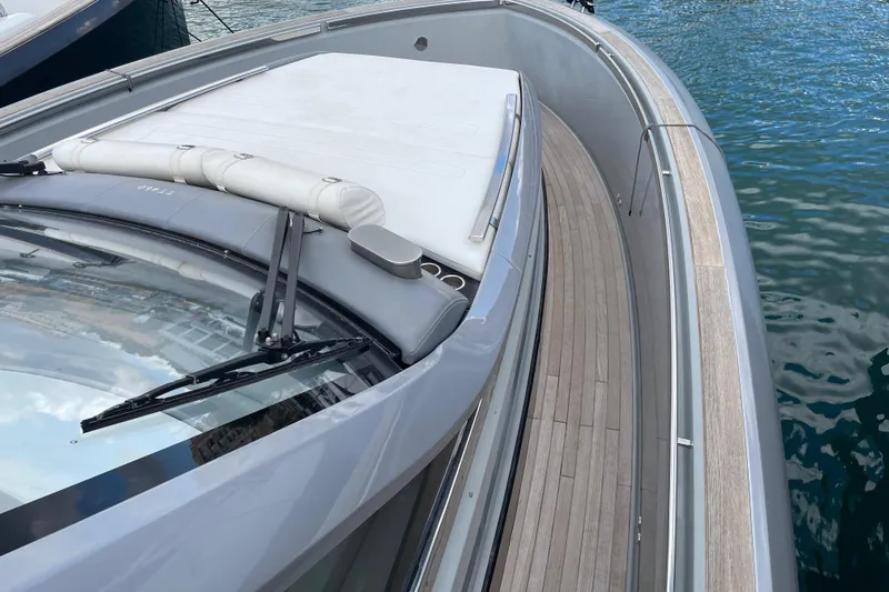  Yacht Photos Pics 2021 Invictus TT460 yacht deck with sleek design and wooden flooring.