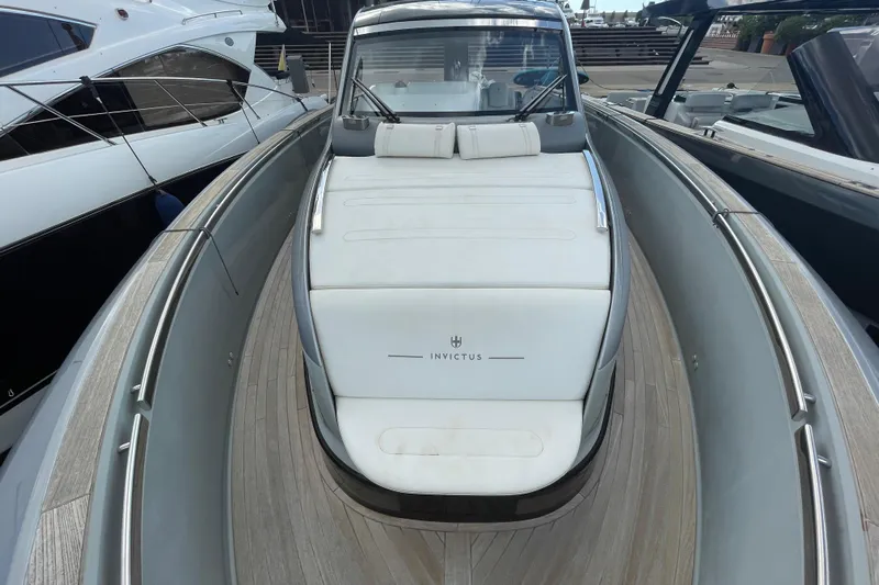  Yacht Photos Pics 2021 Invictus TT460 luxury yacht with sleek design and spacious deck.