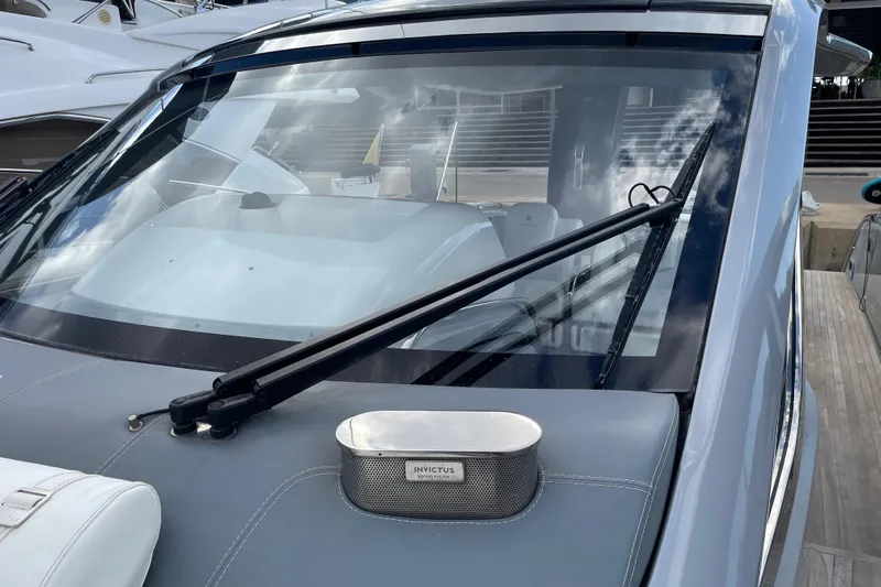  Yacht Photos Pics Invictus TT460 yacht 2021 model, showcasing sleek windshield design and modern detailing.