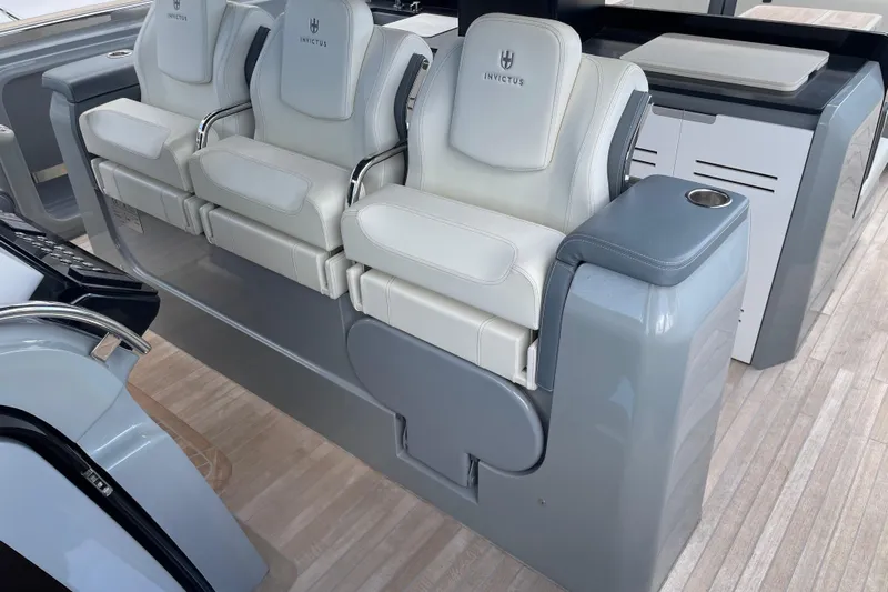  Yacht Photos Pics Luxury seating on 2021 Invictus TT460 yacht, featuring sleek design and premium materials.