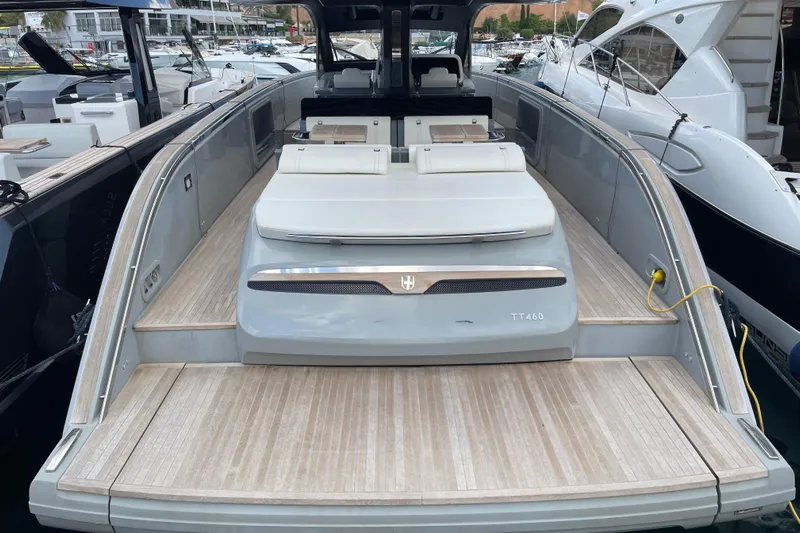  Yacht Photos Pics Luxury 2021 Invictus TT460 yacht with spacious deck, docked at marina.