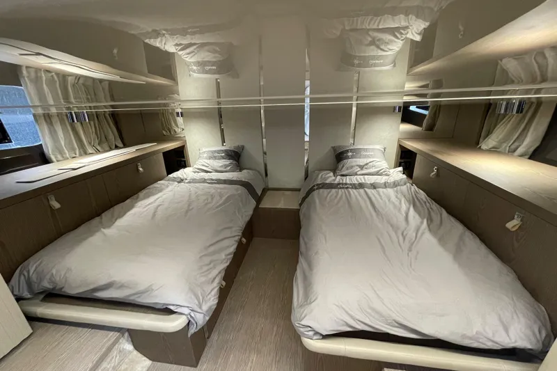  Yacht Photos Pics Luxurious twin cabin interior of 2021 Invictus TT460 yacht with modern design.