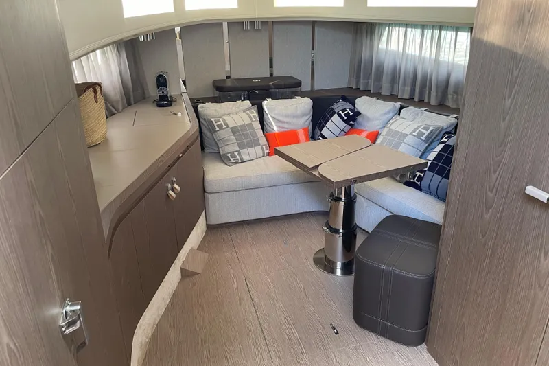  Yacht Photos Pics Luxurious interior of 2021 Invictus TT460 yacht with cozy seating and modern decor.
