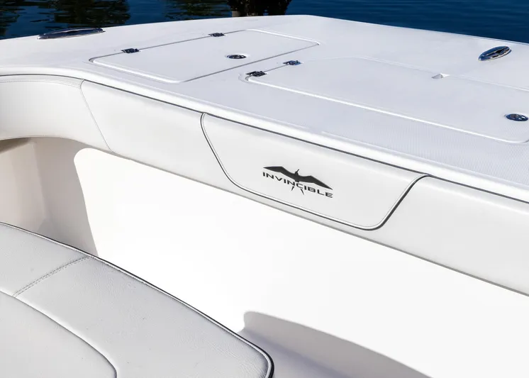  Yacht Photos Pics 2019 Invincible 37 Catamaran interior detail with logo, featuring sleek white seating.