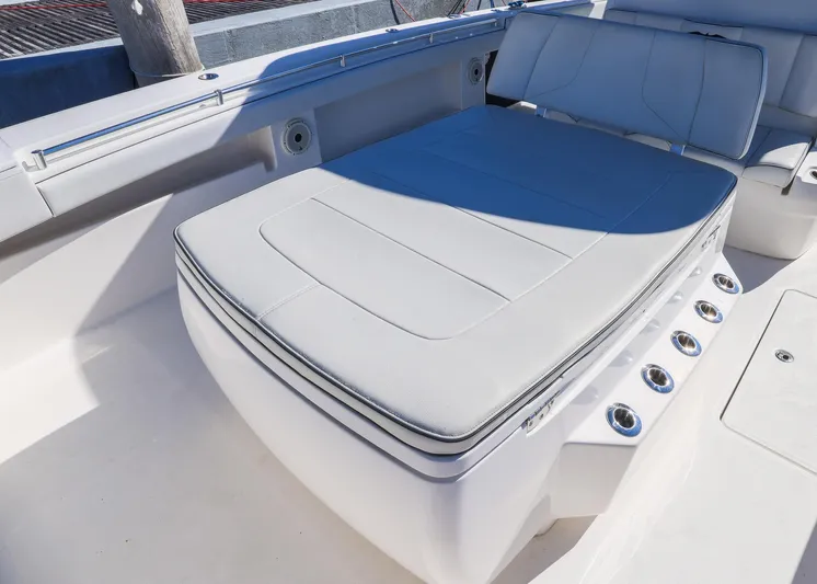 Yacht Photos Pics 2019 Invincible 37 Catamaran interior with cushioned seating and sleek design.