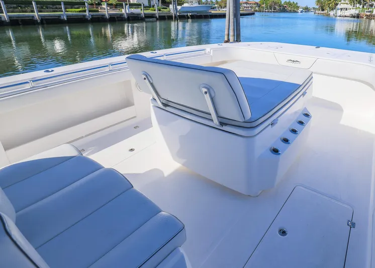  Yacht Photos Pics 2019 Invincible 37 Catamaran interior with cushioned seating, dockside view.