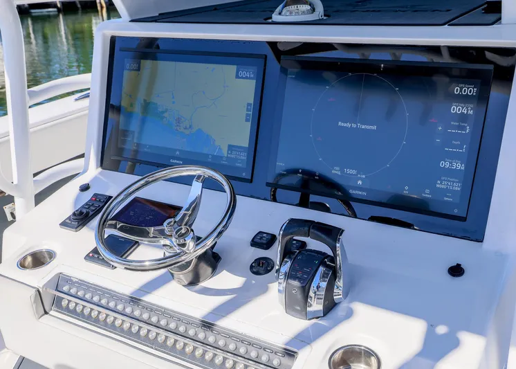  Yacht Photos Pics 2019 Invincible 37 Catamaran dashboard with navigation screens and steering wheel.