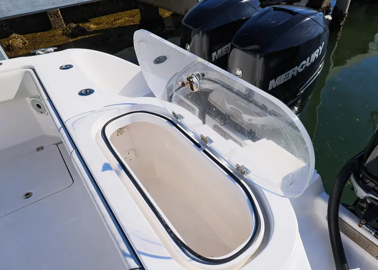  Yacht Photos Pics 2019 Invincible 37 Catamaran with open storage compartment and Mercury outboard engines.