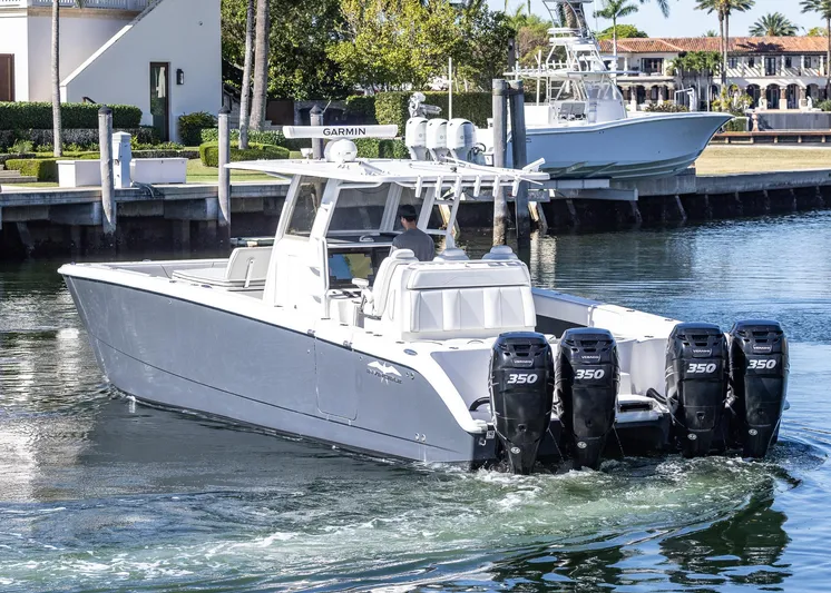  Yacht Photos Pics 2019 Invincible 37 Catamaran with four powerful engines docked in a marina.