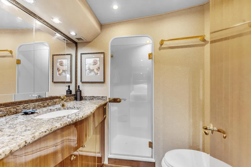 Triple B Yacht Photos Pics Luxurious bathroom in 2007 Viking Convertible yacht with granite countertop and elegant fixtures.