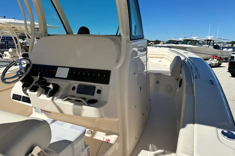  Yacht Photos Pics 2026 Grady-White Canyon 306 boat interior with helm and seating area.