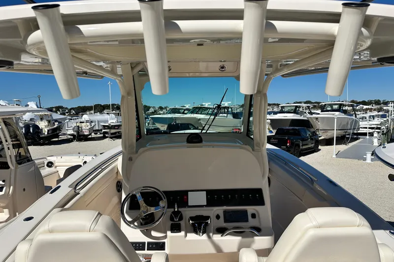  Yacht Photos Pics 2026 Grady-White Canyon 306 boat interior with steering wheel and control panel.