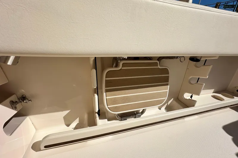  Yacht Photos Pics 2026 Grady-White Canyon 306 boat interior, featuring storage compartments and seating area.