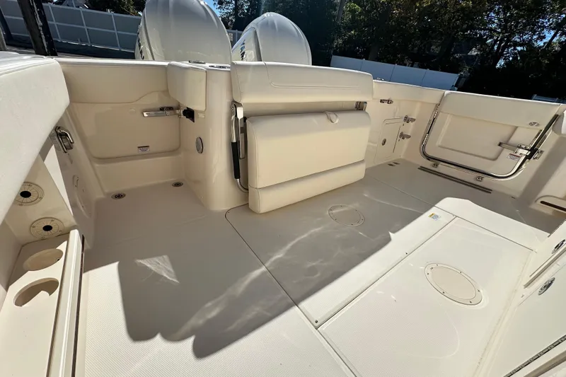  Yacht Photos Pics 2026 Grady-White Canyon 306 boat interior, featuring spacious deck and seating area.