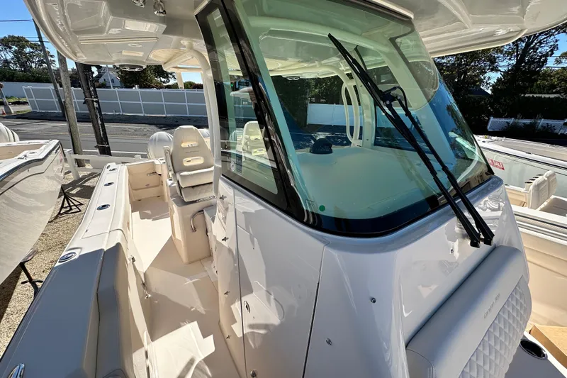  Yacht Photos Pics 2026 Grady-White Canyon 306 boat with sleek design and spacious seating area.