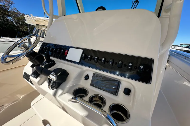 Yacht Photos Pics 2026 Grady-White Canyon 306 boat dashboard with steering wheel and control panel.