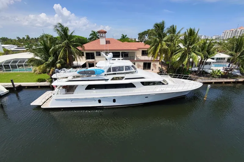 Family Time Yacht Photos Pics 2006 Cheoy Lee 84 Bravo yacht docked by a tropical waterfront home.