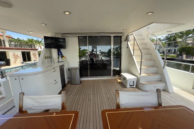 Family Time Yacht Photos Pics Luxurious 2006 Cheoy Lee 84 Bravo yacht deck with seating, stairs, and outdoor amenities.