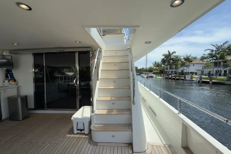 Family Time Yacht Photos Pics Luxury yacht deck of 2006 Cheoy Lee 84 Bravo with stairs and waterfront view.