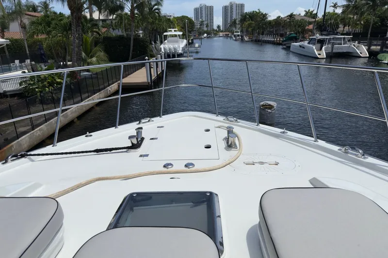 Family Time Yacht Photos Pics Bow view of 2006 Cheoy Lee 84 Bravo yacht in a scenic canal.