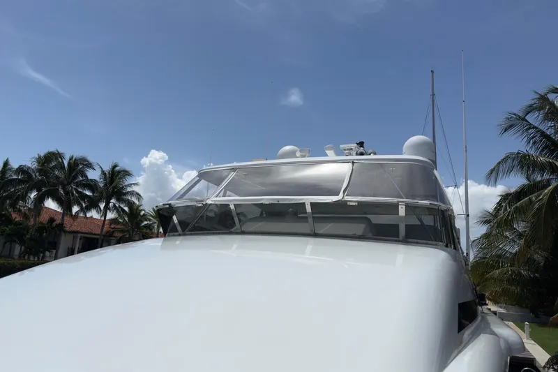 Family Time Yacht Photos Pics 2006 Cheoy Lee 84 Bravo yacht with clear skies and palm trees in the background.