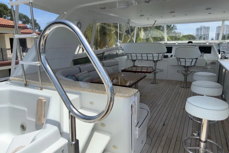 Family Time Yacht Photos Pics Luxurious 2006 Cheoy Lee 84 Bravo yacht interior with seating and helm station.