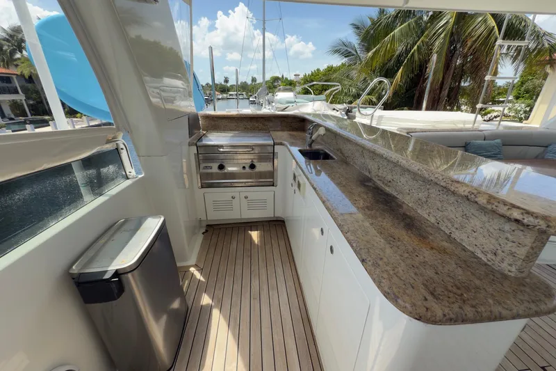 Family Time Yacht Photos Pics Luxurious outdoor kitchen on 2006 Cheoy Lee 84 Bravo yacht with granite countertops.