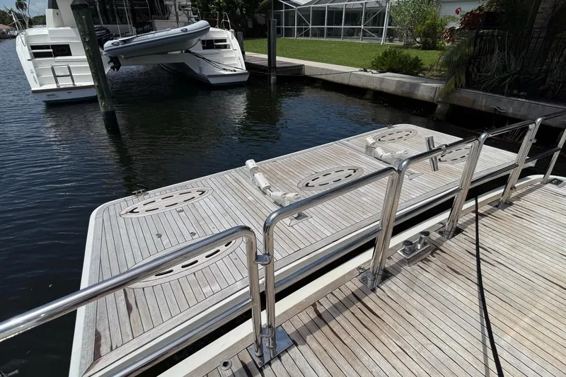 Family Time Yacht Photos Pics Docked 2006 Cheoy Lee 84 Bravo yacht with wooden deck and railing.