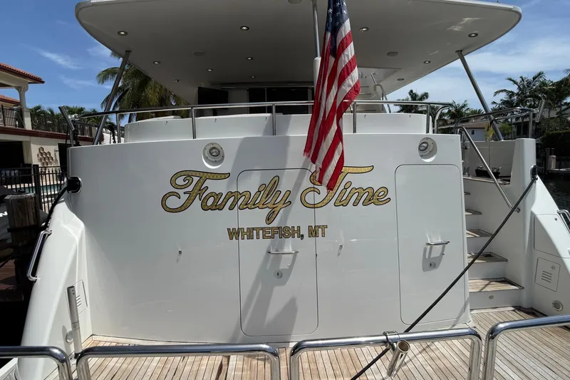 Family Time Yacht Photos Pics 2006 Cheoy Lee 84 Bravo yacht "Family Time" with American flag, docked in Whitefish, MT.