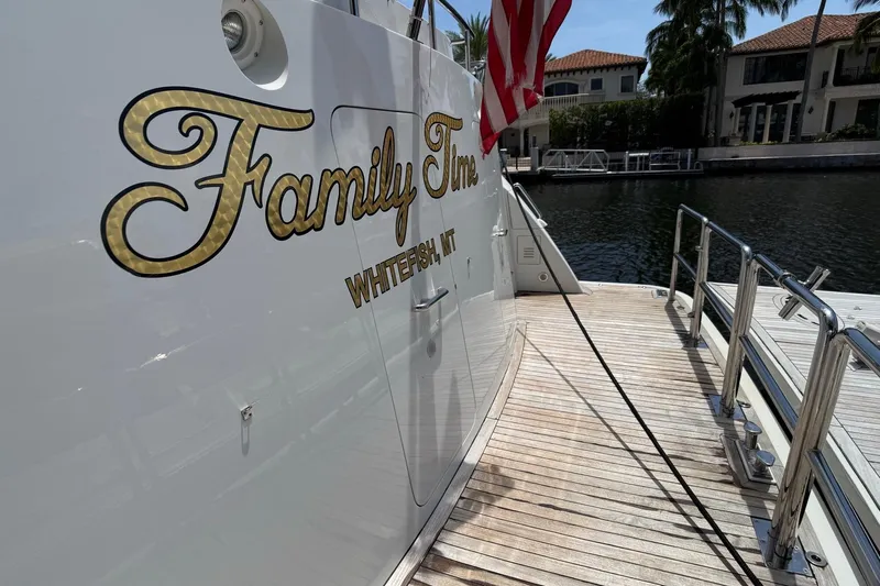 Family Time Yacht Photos Pics 2006 Cheoy Lee 84 Bravo yacht docked, featuring "Family Time" name and American flag.
