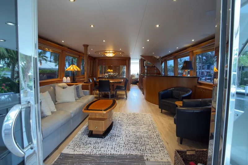 Family Time Yacht Photos Pics Luxurious interior of 2006 Cheoy Lee 84 Bravo yacht with elegant furnishings and ambient lighting.