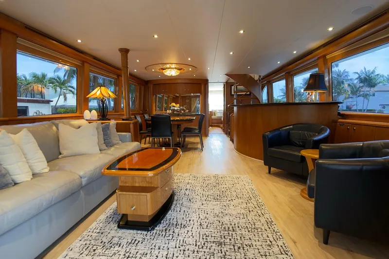 Family Time Yacht Photos Pics Luxurious interior of 2006 Cheoy Lee 84 Bravo yacht with elegant furnishings and large windows.