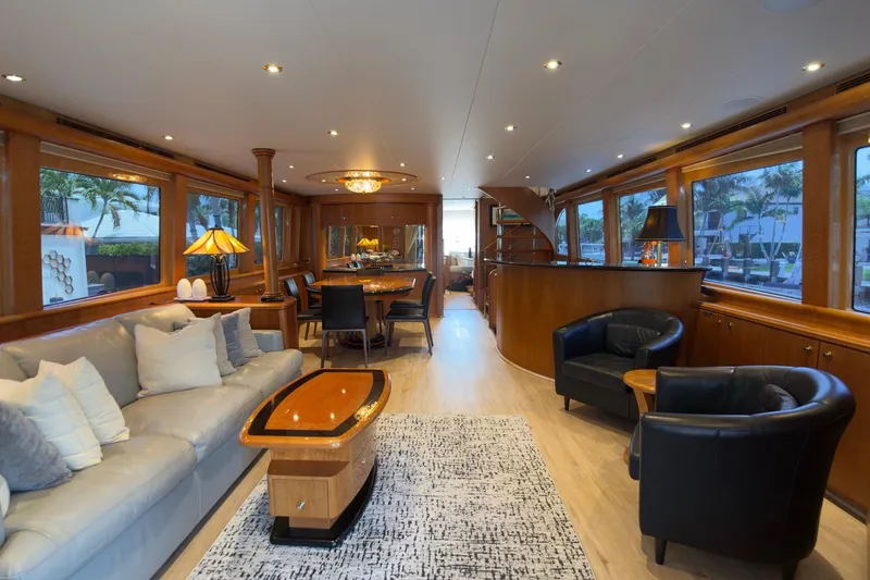 Family Time Yacht Photos Pics Luxurious interior of 2006 Cheoy Lee 84 Bravo yacht with elegant furnishings and ambient lighting.