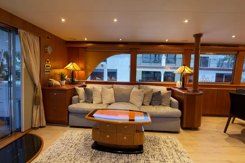 Family Time Yacht Photos Pics Luxurious interior of 2006 Cheoy Lee 84 Bravo yacht with elegant furnishings and ambient lighting.