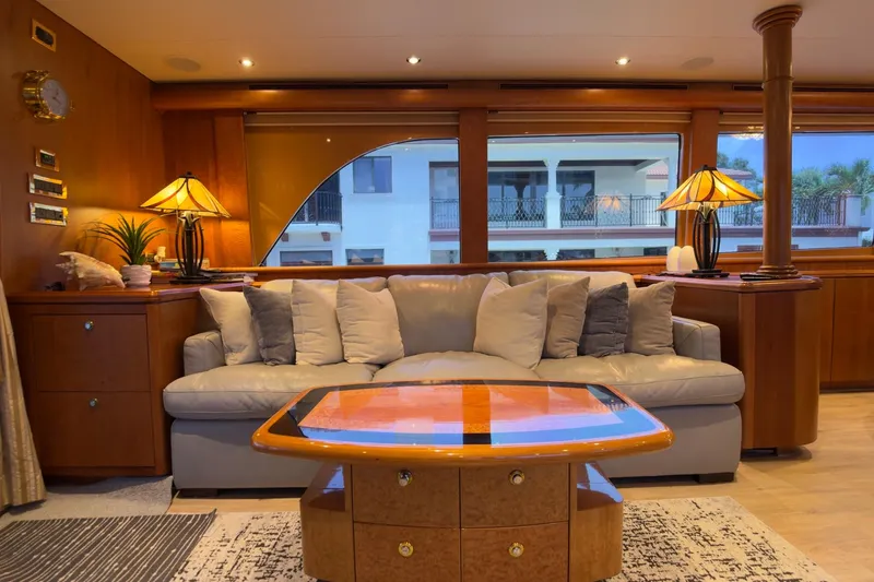 Family Time Yacht Photos Pics Luxurious 2006 Cheoy Lee 84 Bravo yacht interior with elegant seating and stylish decor.