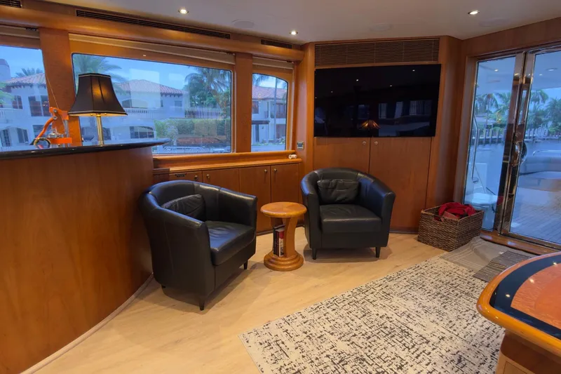 Family Time Yacht Photos Pics Luxurious 2006 Cheoy Lee 84 Bravo yacht interior with leather chairs and elegant decor.