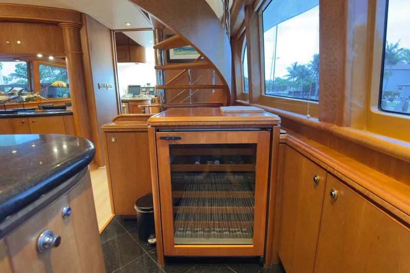 Family Time Yacht Photos Pics Luxurious interior of 2006 Cheoy Lee 84 Bravo yacht with elegant wood finishes.