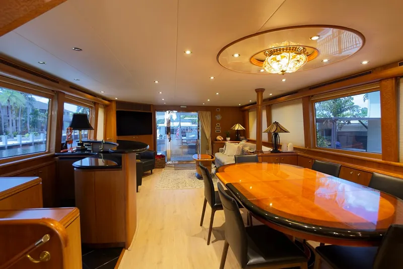 Family Time Yacht Photos Pics Luxurious interior of 2006 Cheoy Lee 84 Bravo yacht with elegant dining area and modern decor.