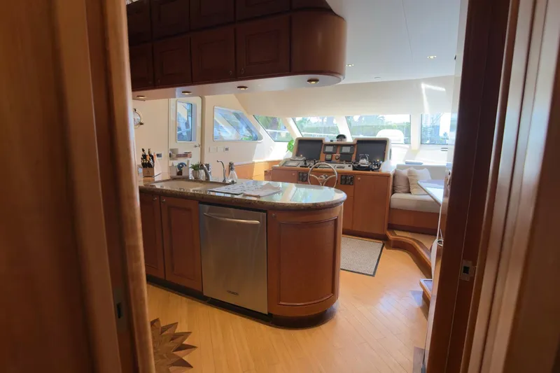 Family Time Yacht Photos Pics Luxurious interior of 2006 Cheoy Lee 84 Bravo yacht with elegant wood finishes.