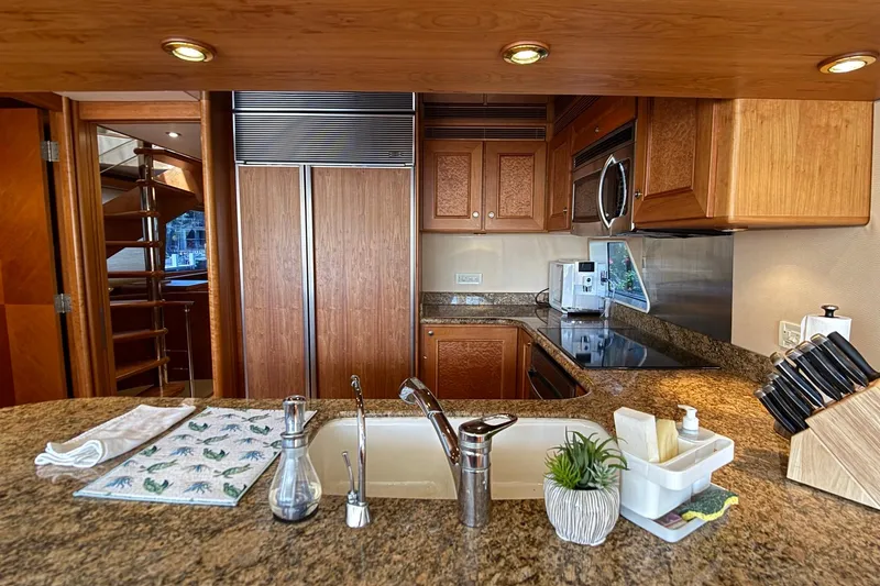 Family Time Yacht Photos Pics Luxurious kitchen interior of 2006 Cheoy Lee 84 Bravo yacht with modern amenities.