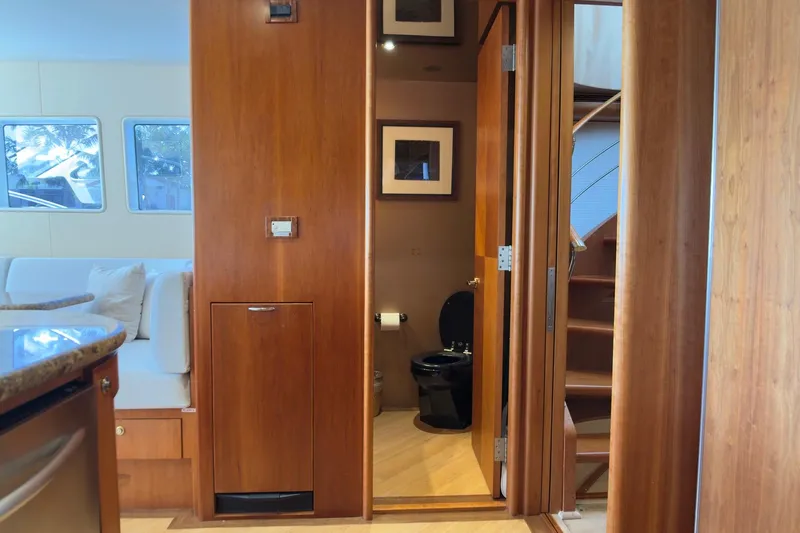 Family Time Yacht Photos Pics Luxurious interior of 2006 Cheoy Lee 84 Bravo yacht with wooden finishes and modern amenities.