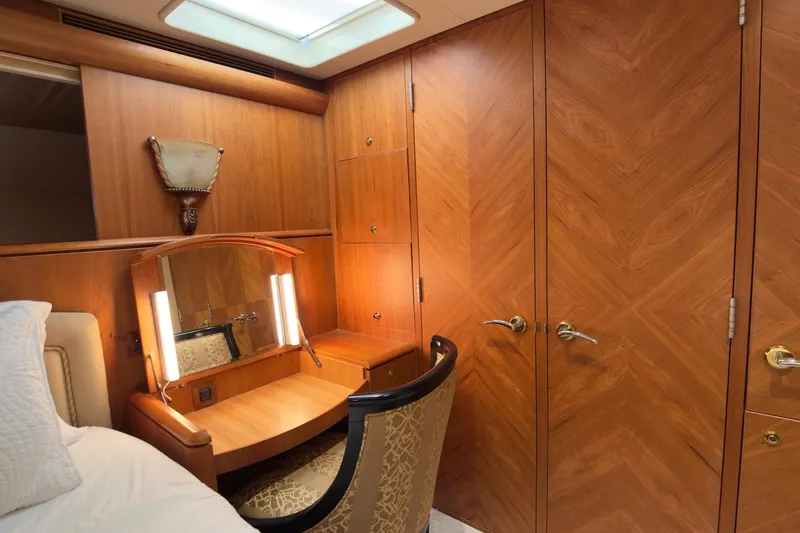 Family Time Yacht Photos Pics Luxurious wooden interior of 2006 Cheoy Lee 84 Bravo yacht with vanity and elegant chair.