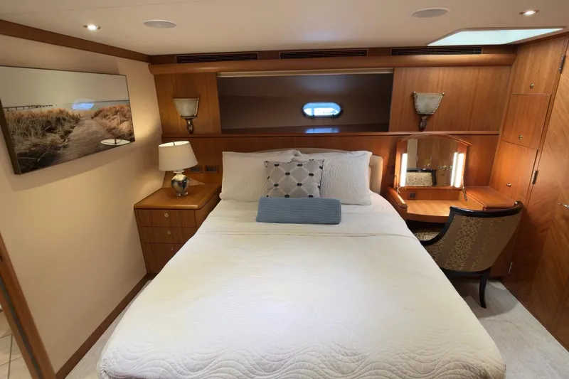 Family Time Yacht Photos Pics Luxurious bedroom interior of 2006 Cheoy Lee 84 Bravo yacht with elegant furnishings.