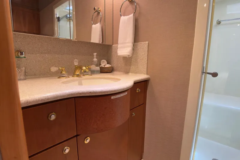 Family Time Yacht Photos Pics Luxurious bathroom in 2006 Cheoy Lee 84 Bravo yacht with elegant fixtures and cabinetry.